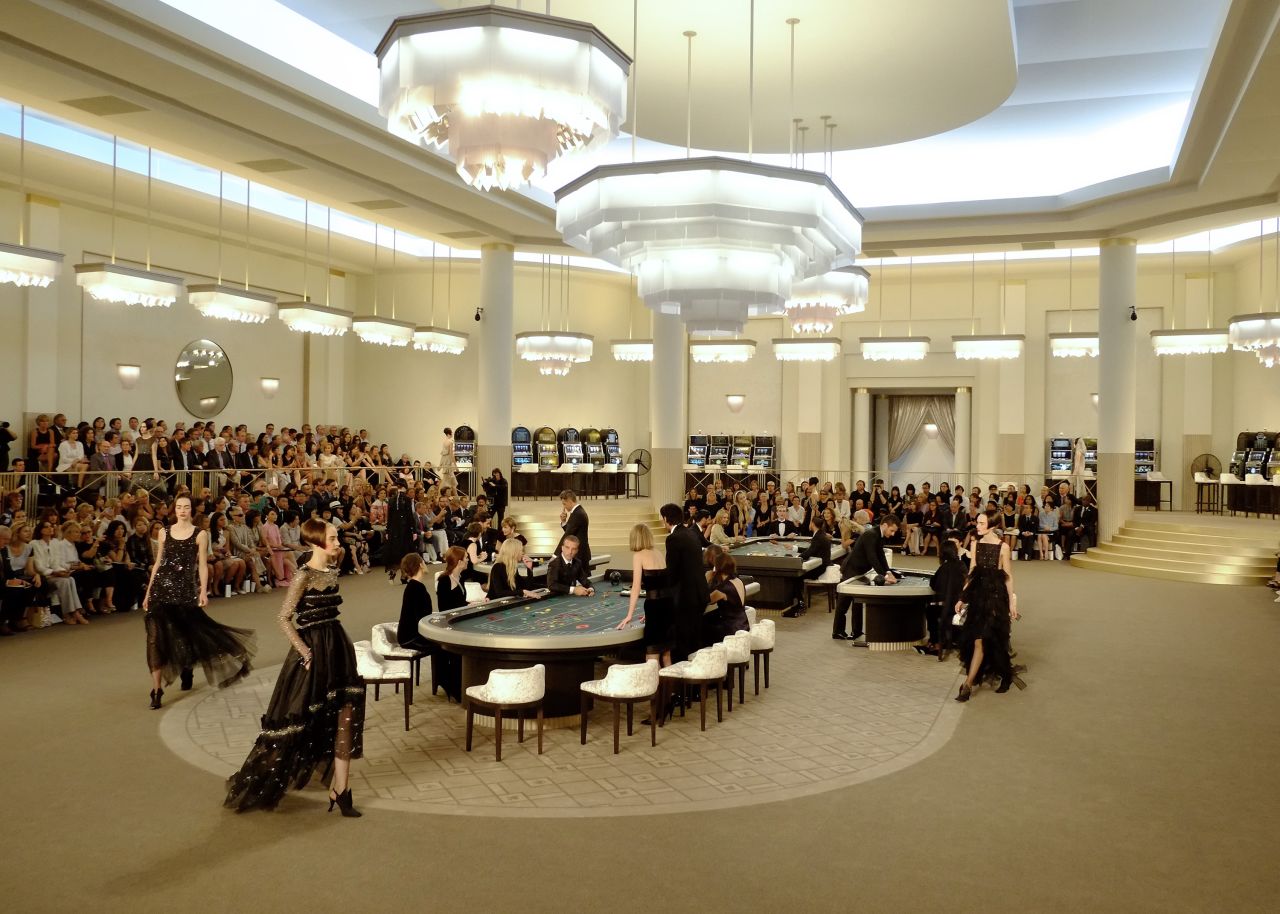 Turning a simple fashion show into an interactive production, Chanel's fall/winter 2015/2016 show invited guests to experience the new collection under the guise of a casino set-up. 