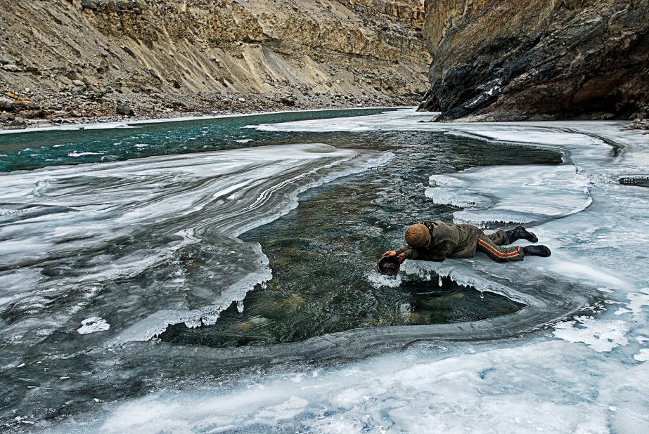 One of the ironies on the Chadar river trek is the lack of drinking water. Breaking ice and melting it is a tiring task. Despite the risk, the Zanskaris prefer scooping water from exposed sections of the river.