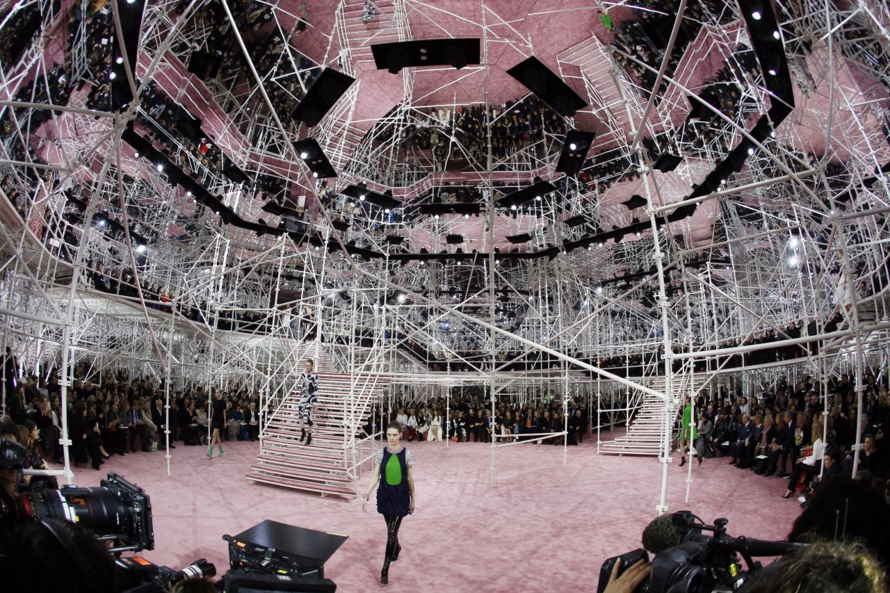 With Raf Simons taking over the role of creative director, Dior's spring/summer 2015 collection was revealed against a hectic backdrop of scaffolding and mirrors.