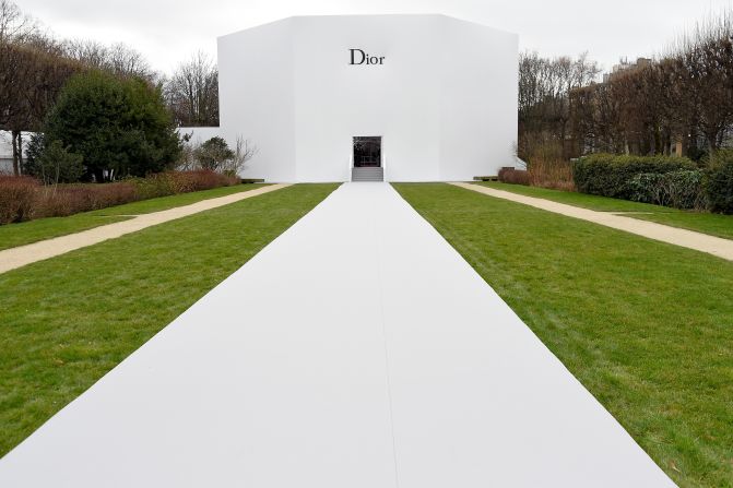 In contrast to its busy interior, the all-white exterior of the Dior spring/summer 2015 set popped out against the greenery of its Parisian garden backdrop. 