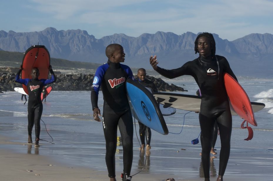 Apish Tshetsha (on the right) is a Waves for Change coach. All W4C coaches are local community members, trained to engage with kids referred into their programs. 