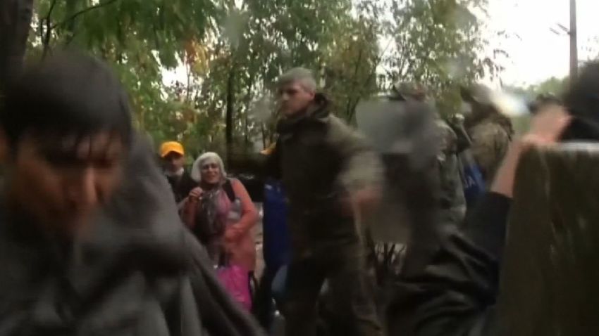 macedonia police swings baton refugees ct_00000522.jpg