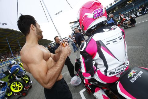 Usually, before a race starts, female models hold umbrellas over the riders on the grid. However, at the 2014 Dutch MotoGP in Assen, Carrasco arrived with a muscular man, causing an amused stir in the paddock.