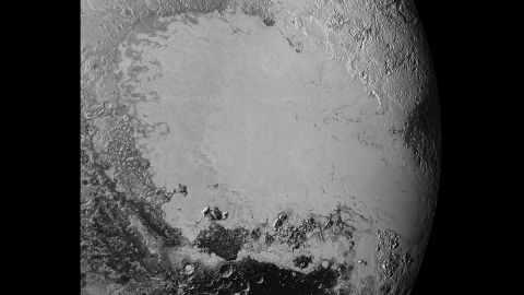 Scientists say that what looks like mountains could be huge blocks of frozen water suspended in frozen nitrogen. On the new photos, taken on July 14 and released on September 10, a pixel is 400 meters (440 yards). New Horizons' closest pass by Pluto took it about 50,000 miles from the surface.