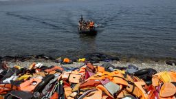 Migrants arrive on the shores of the Greek island of Lesbos after crossing the Aegean Sea from Turkey on a dinghy on September 10, 2015. The EU unveiled plans to take 160,000 refugees from overstretched border states, as the United States said it would accept more Syrians to ease the pressure from the worst migration crisis since World War II. AFP PHOTO / ANGELOS TZORTZINIS        (Photo credit should read ANGELOS TZORTZINIS/AFP/Getty Images)