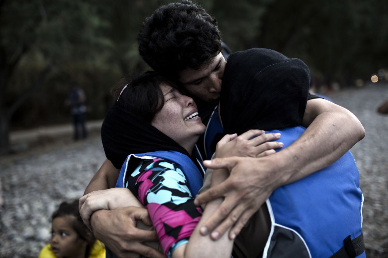 A woman cries after arriving on the island of Lesbos, after crossing the Aegean Sea from Turkey on a dinghy on September 10.