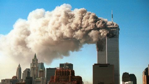 SEPTEMBER 11, 2001: Smoke pours from the twin towers of the World Trade Center after they were hit by two hijacked airliners in a terrorist attack.  