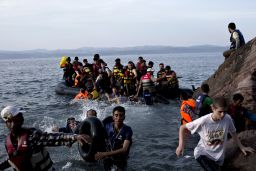 Migrants arrive on the Greek island of Lesbos after crossing the Aegean Sea.