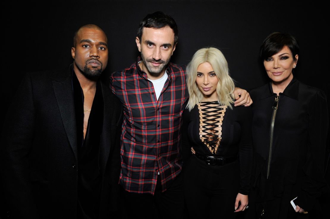 Riccardo Tisci (center) with Kanye West and Kim Kardashian