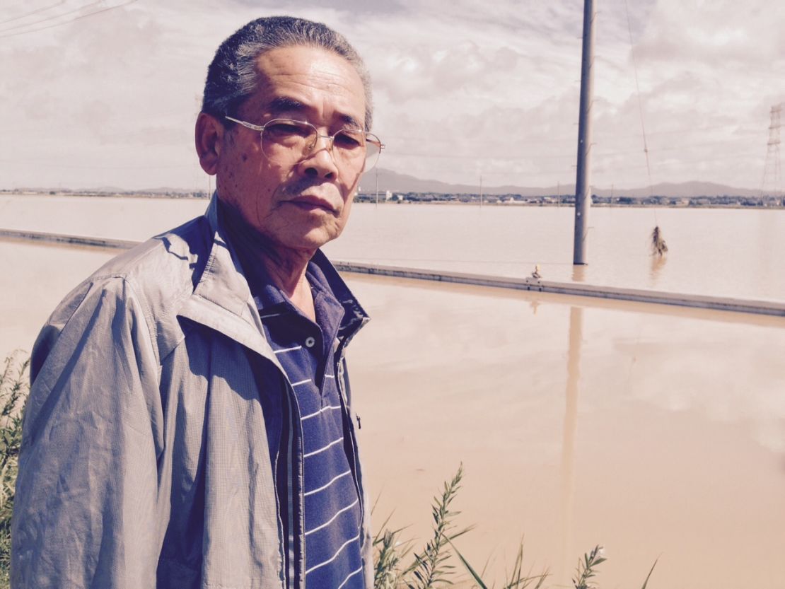 Business owner Shigeru Kikuchi was stranded when his car broke down while trying to drive along flooded streets.