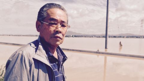 Business owner Shigeru Kikuchi was stranded when his car broke down while trying to drive along flooded streets.