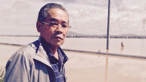 Business owner Shigeru Kikuchi was stranded when his car broke down while trying to drive along flooded streets.