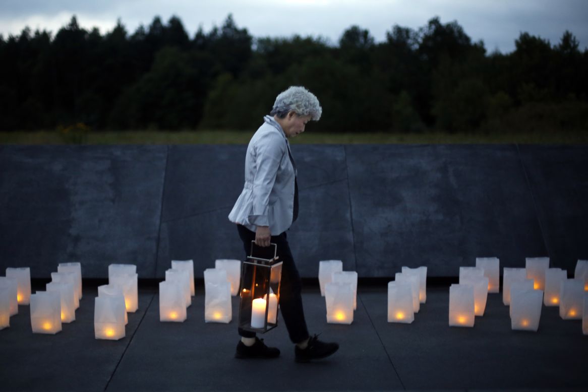 Yachiyo Kuge carries a lantern to place  at the Wall of Names at the Flight 93 National Memorial in Shanksville, Pennsylvania, on Thursday, September 10. Kuge is the mother of Toshiya Kuge, a Japanese passenger who died on United Airlines Flight 93 on 9/11. The plane crashed in Pennsylvania as passengers and crew tried to overcome the hijackers.