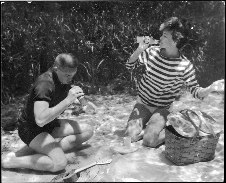 Monroe points out that Mozert's attention to detail and experimentation with props and materials allowed for each underwater photo to so perfectly reflect the on-ground scene it was depicting. "Tiny fishing weights ensured that the hula dancer's grass skirt wouldn't float upwards, the bubbly in the glass of champagne resulted from Alka-Seltzer tablets, the smoke from the barbequing steak was made from condensed powdered milk."