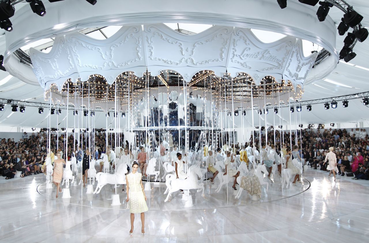 Another production by Marc Jacobs, the curtain at this Louis Vuitton show was lifted to reveal a giant all-white carousel, with models perched on every horse. 