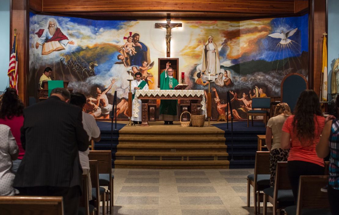 Parishioners pray at a Saturday evening Spanish Mass at Our Lady of Fatima. It's the only regular Mass remaining there. The building became a Catholic community outreach center after a parish merger. 