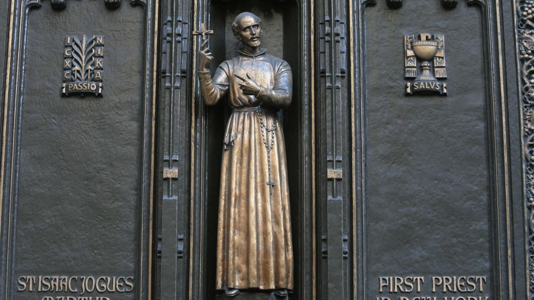 This is a statue of <strong>St. Isaac Jogues</strong>, thought to be the first Catholic priest to go to Manhattan, at New York City's St. Patrick's Cathedral. He is best known for his work as a missionary to the Huron and Algonquian nations in the area colonized by France in what is now the United States and Canada.  Jogues, who died in 1646 after he was hit with a Mohawk tomahawk, is the patron saint of the Americas and Canada. 