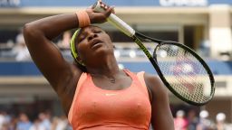 Serena Williams of the US wipes her forehead while playing Roberta Vinci of Italy during their US Open 2015 women's singles semifinals match at the USTA Billie Jean King National Center September 11, 2015  in New York. AFP PHOTO/TIMOTHY A. CLARY        (Photo credit should read TIMOTHY A. CLARY/AFP/Getty Images)