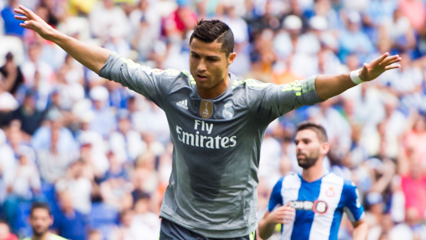 Cristiano Ronaldo set a new Real Madrid scoring record as his team routed Espanyol.