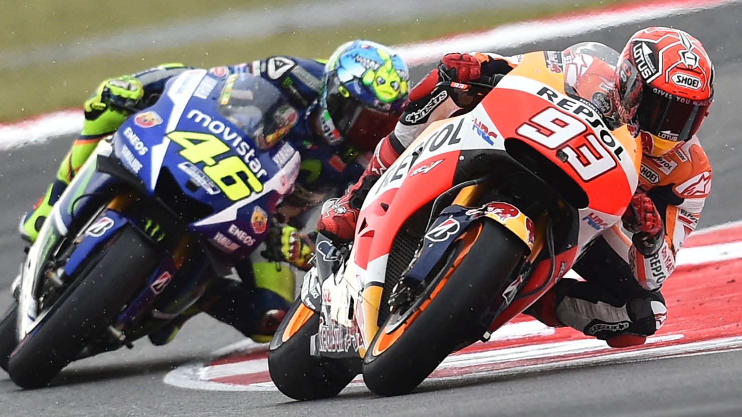Marc Marquez is tracked by championship leader Valentino Rossi on his way to victory in the San Marino MotoGP at Misano.
