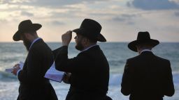 Ultra-Orthodox Jews perform the Tashlich prayer while facing the Mediterranean Sea at sunset of the second day of Rosh Hashanah, the Jewish new year, on September 20, 2009, in Tel Aviv, Israel. (Photo by David Silverman/Getty Images)