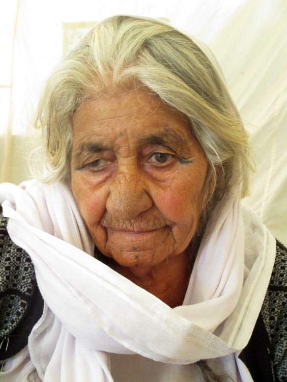 Bushra, 16, took portraits of Yazidis in the camp where she lives, including this old Yazidi woman.