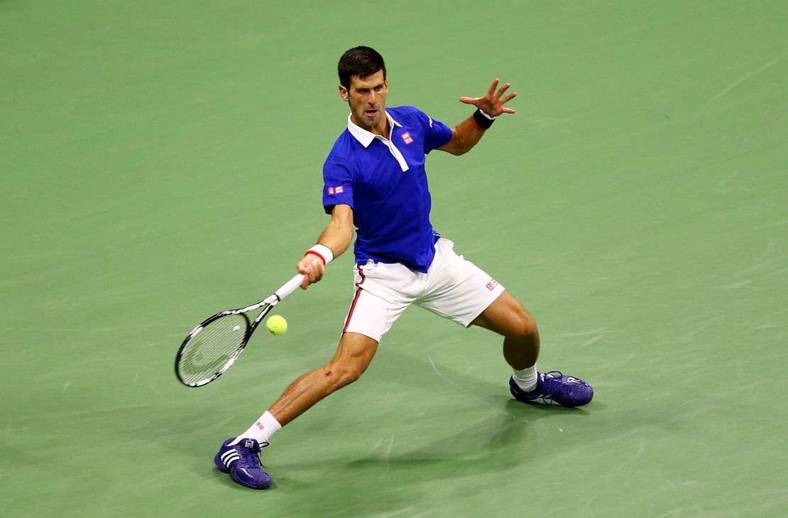 Djokovic returns a forehand shot to Federer.