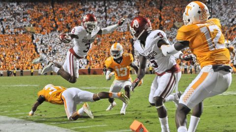Oklahoma wide receiver Sterling Shepard jumps over a Tennessee defender to score a touchdown in double overtime Saturday, September 12, in Knoxville, Tennessee. It turned out to be the game-winning score as Oklahoma rallied from a 17-0 deficit to win 31-24.