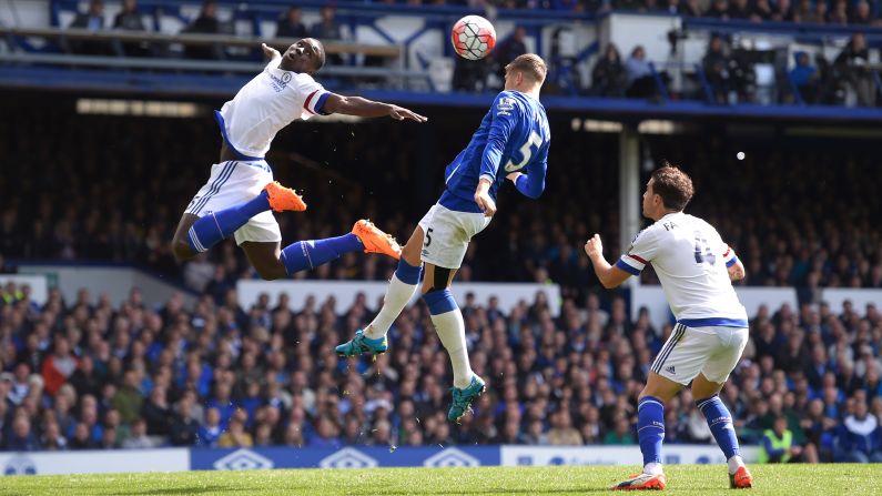 Everton's John Stones wins a header between Chelsea players Kurt Zouma, left, and Cesc Fabregas during a Premier League game in Liverpool, England, on Saturday, September 12.
