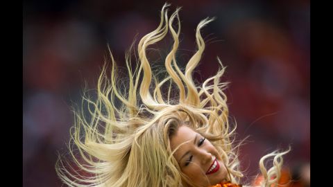 A cheerleader for the BC Lions performs during a Canadian Football League game in Vancouver, British Columbia, on Sunday, September 13.