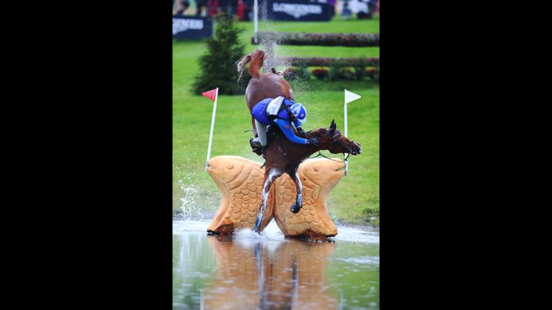 Mikhail Nastenko falls off his horse Reistag during an equestrian event in Blair Atholl, Scotland, on Saturday, September 12.