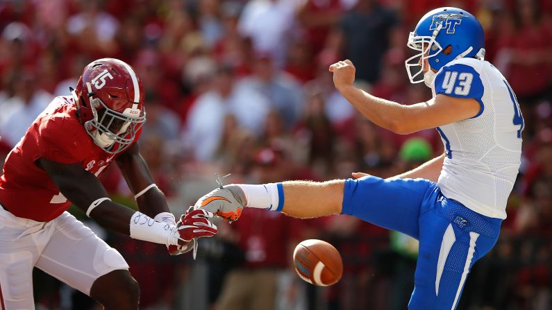 Alabama's Ronnie Harrison blocks a punt from Middle Tennessee's Trevor Owens during a college football game Saturday, September 12, in Tuscaloosa, Alabama. Alabama won the game 37-10.