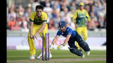 Australia's Pat Cummins, left, looks to run out England's James Taylor during a One Day International match in Manchester, England, on Tuesday, September 8. England won by 93 runs.