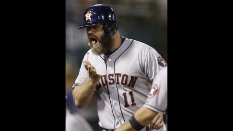 Houston's Evan Gattis throws gummy bears into his mouth after hitting a home run in Oakland, California, on Wednesday, September 9. A teammate <a href="http://m.mlb.com/cutfour/2015/09/10/148438470" target="_blank" target="_blank">handed him the snack</a> at home plate.