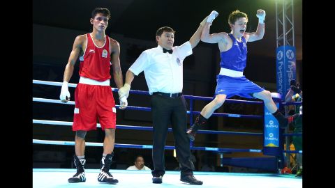 Australian boxer Jack Bowen celebrates Thursday, September 10, after he defeated India's Gaurav Solanki to win flyweight gold at the Commonwealth Youth Games.
