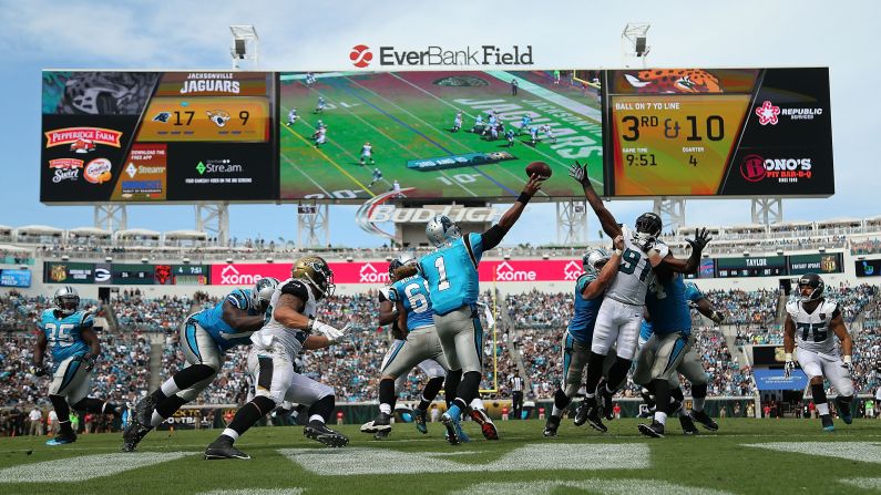 Carolina quarterback Cam Newton throws a pass during an NFL game in Jacksonville, Florida, on Sunday, September 13. <a href="index.php?page=&url=http%3A%2F%2Fwww.cnn.com%2F2015%2F09%2F08%2Fsport%2Fgallery%2Fwhat-a-shot-sports-0908%2Findex.html" target="_blank">See 38 amazing sports photos from last week</a>