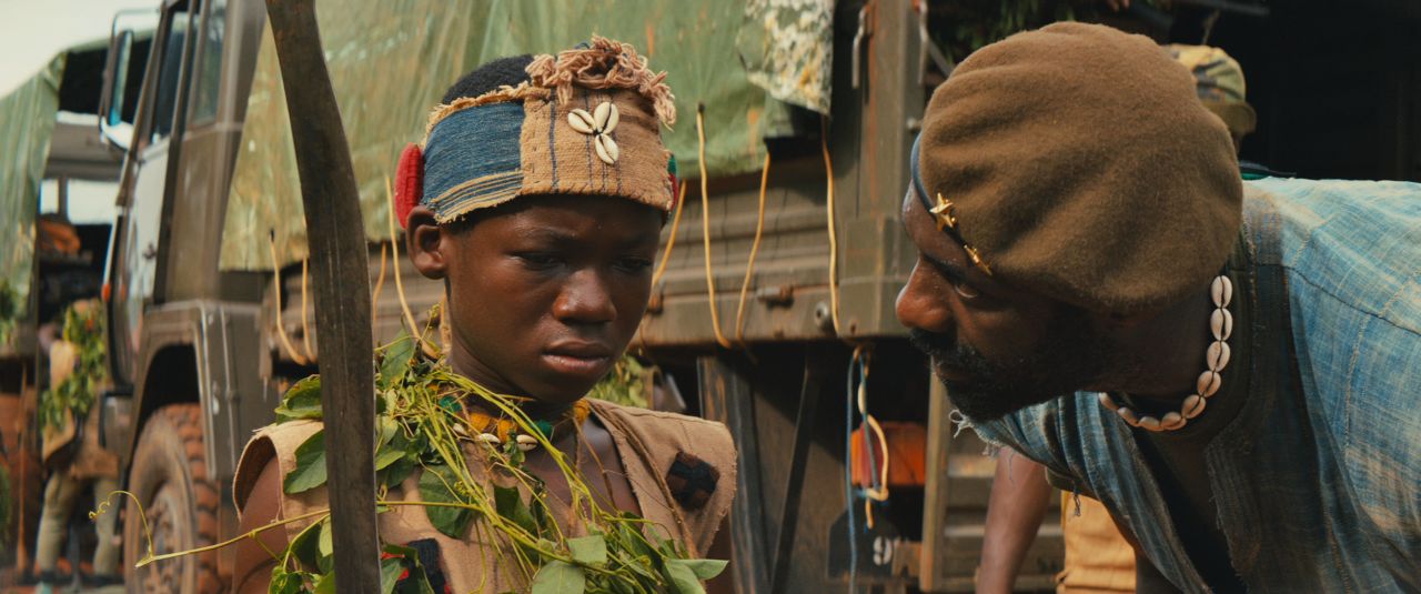 Elba plays a brutal warlord who forces child soldier named Agu, (Attah) to become a killer.