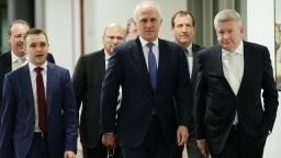CANBERRA, AUSTRALIA - SEPTEMBER 14:  Minister for Communications Malcolm Turnbull and supporters arrive at the Liberal party room for the leadership ballot at Parliament House on September 14, 2015 in Canberra, Australia. Malcolm Turnbull announced this morning he would be challenging Tony Abbott for the Liberal Party leadership.  (Photo by Stefan Postles/Getty Images)
