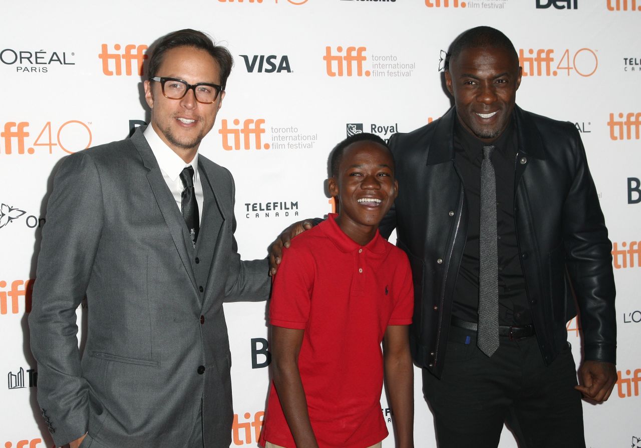 The 14-year-old had the lead role in "Beasts Of No Nations," a film by Cary Fukunaga (left), also starring Idris Elba.