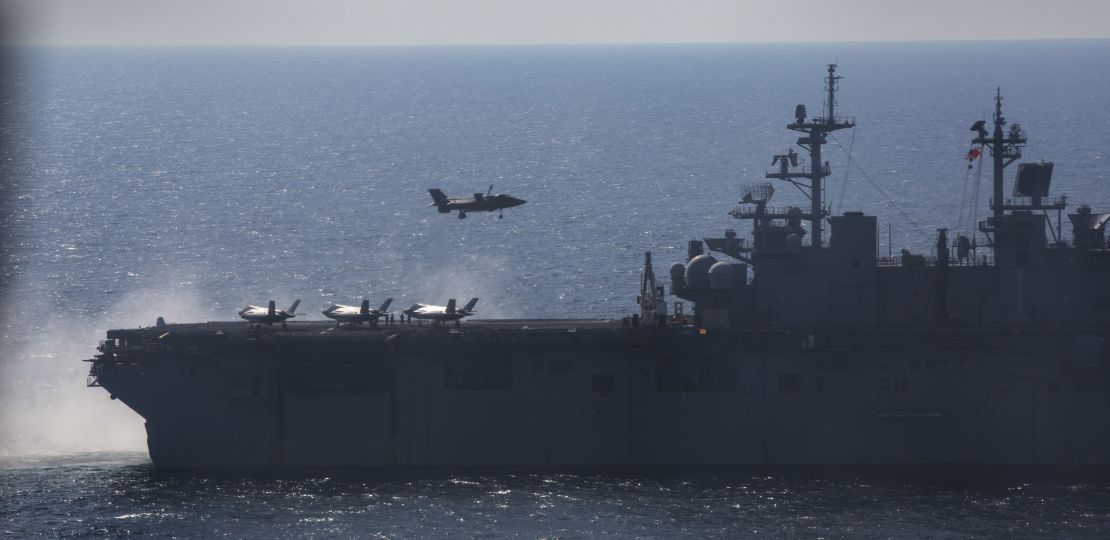 An F-35B Lightning II Joint Strike Fighter lands on the flight deck of the amphibious assault ship USS Wasp