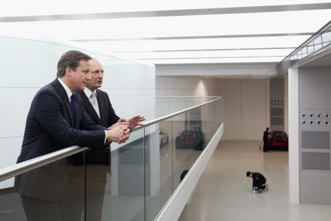 British Prime Minister David Cameron chats with Ron Dennis, the Executive Chairman of McLaren Automotive, during a visit to the McLaren Technology Centre (MTC) in 2011. Dennis wants the MTC to showcase the best of British engineering and technology.