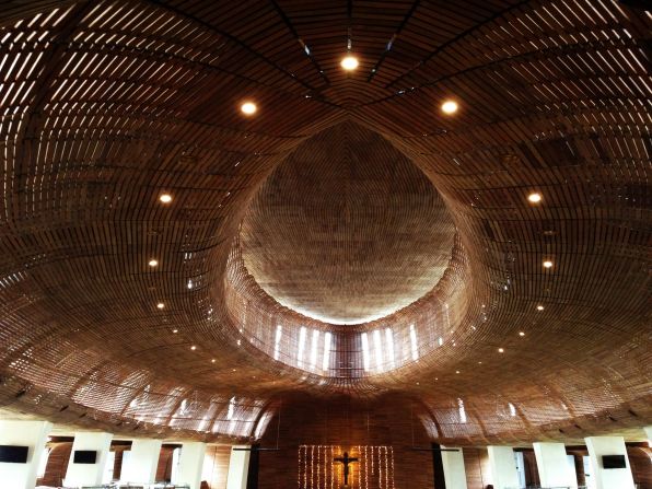 This church's design is made of three concentric ovals and its warm, intimate interior is lined with timber. Teak wood slats are horizontally secured onto steel frames. Director of the Indonesian branch of Denton Corker Marshall, Budiman Hendropurnomo says the use of these materials and structure of design are intended to create acoustics that "would have the likeness of singing inside a violin." 
