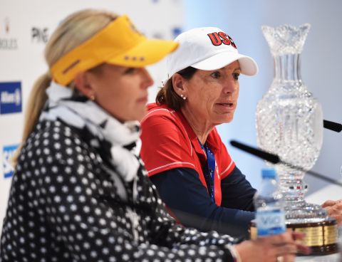 European captain Carin Koch (L) and her American counterpart Inkster, face the cameras with the Solheim Cup prior to the event at St. Leon-Rot Golf Club.