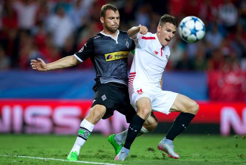  Kevin Gameiro (R) of Sevilla FC competes for the ball with Tony Jantschke (L) of Borussia Monchengladbach during the UEFA Champions League Group D match between Sevilla FC and VfL Borussia Monchengladbach at Estadio Ramon Sanchez Pizjuan on September 15, 2015 in Seville, Spain.