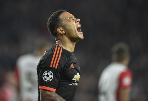 As promised, Manchester's Dutch forward Memphis Depay celebrates after scoring the opening goal during the UEFA Champions League Group B football match between PSV Eindhoven and Manchester United at the Philips stadium in Eindhoven.