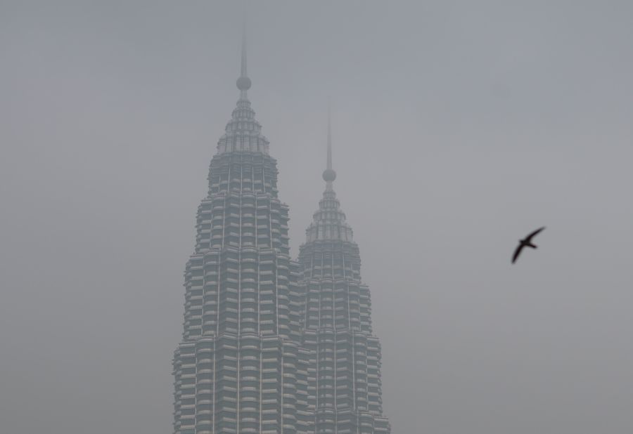 Malaysia's iconic Petronas Twin Towers are seen cloaked in haze in Kuala Lumpur on September 15.