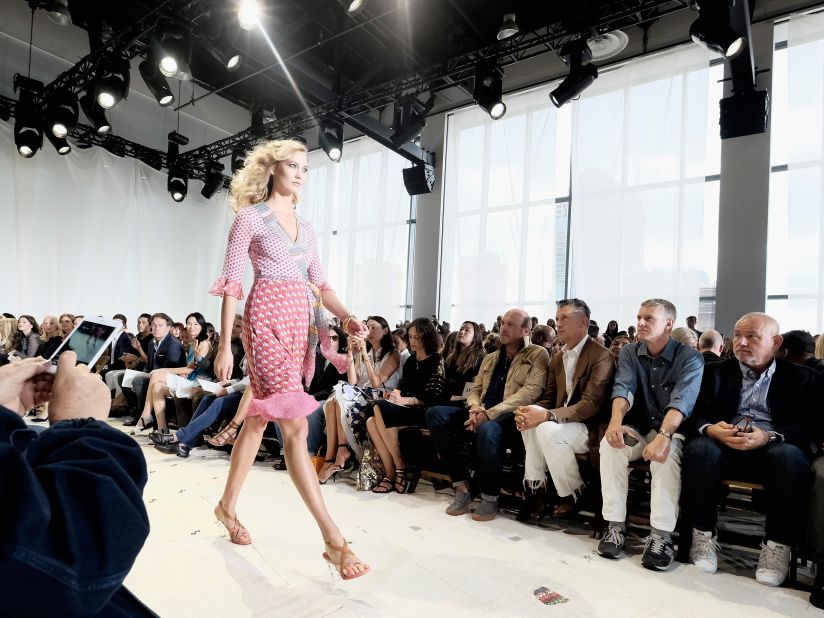 Model Karlie Kloss walks the runway in a DVF signature wrap dress. 