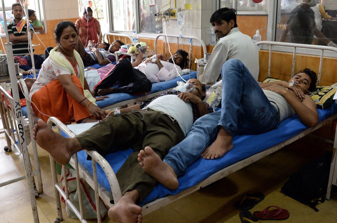 Patients share beds at Hindu Rao Hospital in New Delhi on September 16, 2015.