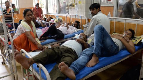 Patients share beds at Hindu Rao Hospital in New Delhi on September 16, 2015.