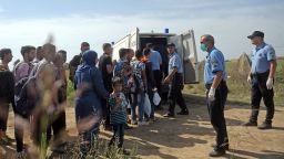 Croatian police officers round-up migrants and refugees near the village of Tovarnik, close to the official Serbia-Croatia border on September 16, 2015. Migrants and refugees began to cross from Serbia into Croatia, desperate to find a new way into the European Union after Hungary sealed its border and a string of EU countries tightened frontier controls in the face of an unprecedented human influx. AFP PHOTO / ALEXA STANKOVICALEXA STANKOVIC/AFP/Getty Images